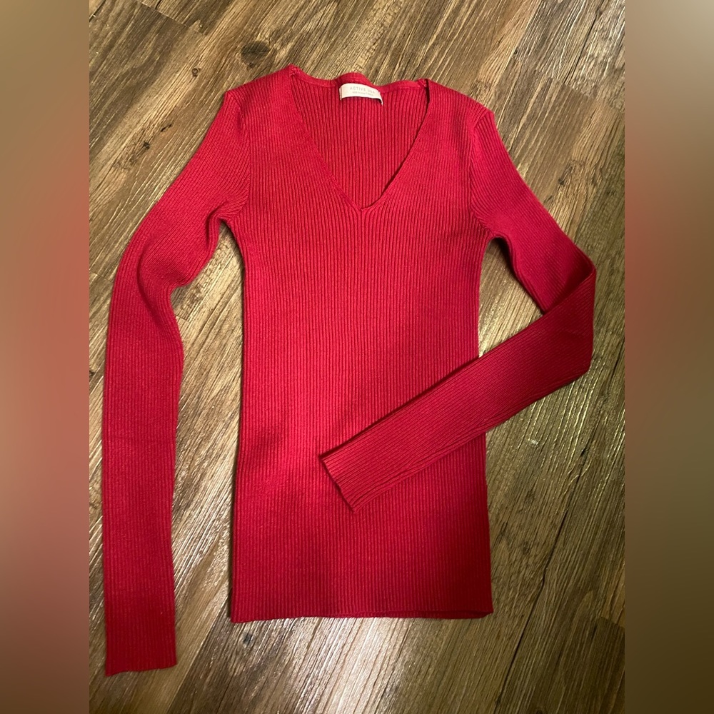 Cranberry colored ribbed sweater top.
Tagged for exposure.